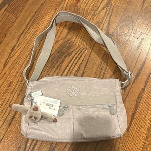 Kipling Light Gray Crossbody Bag with Charm